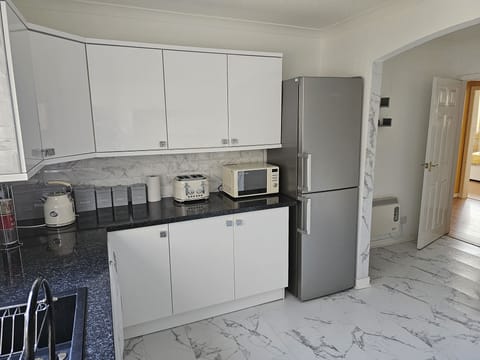 Apartment | Private kitchen | Full-size fridge, microwave, oven, stovetop