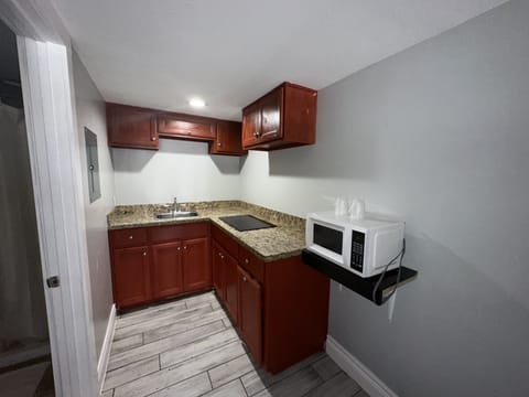 Standard Room, 2 Queen Beds | Private kitchen | Mini-fridge, microwave, coffee/tea maker