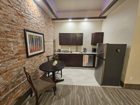 Deluxe Studio Suite | Private kitchen | Full-size fridge, microwave, stovetop, coffee/tea maker