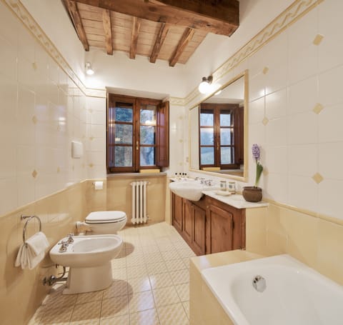 Combined shower/tub, designer toiletries, hair dryer, bathrobes