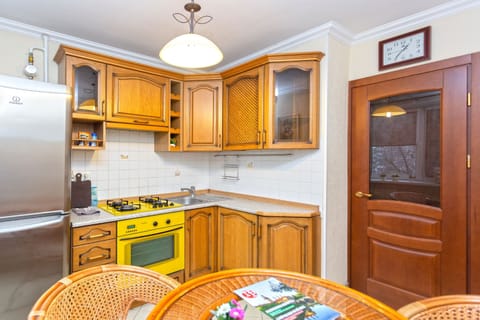 Classic Apartment | Private kitchen | Fridge, electric kettle, cookware/dishes/utensils, cleaning supplies