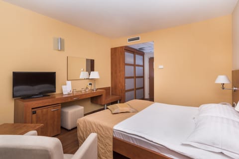 Economy Room (French bed park side) | 1 bedroom, in-room safe, desk, blackout drapes