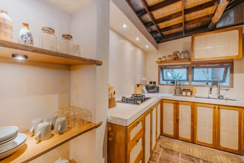 Deluxe Villa | Private kitchen | Stovetop, electric kettle, toaster, rice cooker