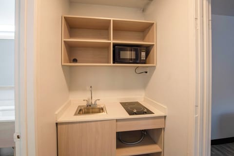 Suite, 2 Queen Beds, Non Smoking | Private kitchenette | Fridge, microwave, stovetop