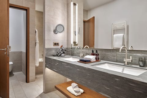 Designer toiletries, hair dryer, bathrobes, slippers