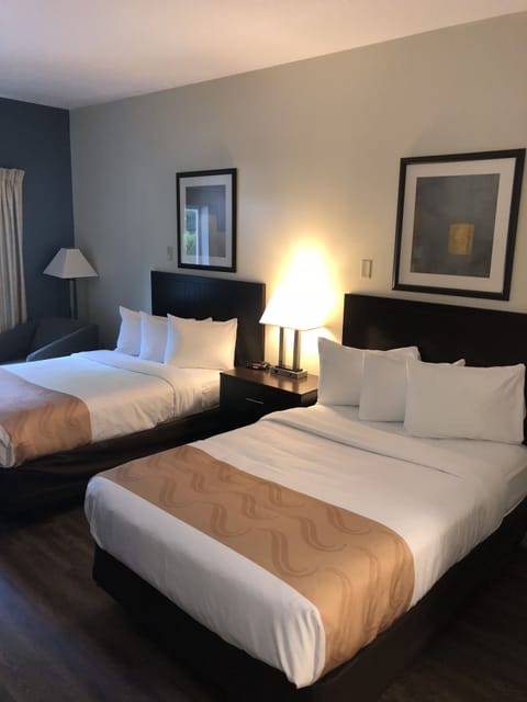 Desk, laptop workspace, blackout drapes, iron/ironing board