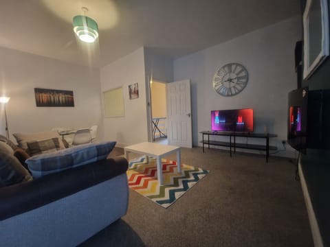 Apartment | Living area | TV, fireplace