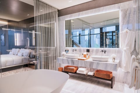 Ambassador Suite | Bathroom | Designer toiletries, hair dryer, bathrobes, towels