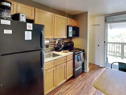 Studio Suite, 1 Queen Bed, Balcony | Private kitchen | Fridge, microwave, oven, stovetop