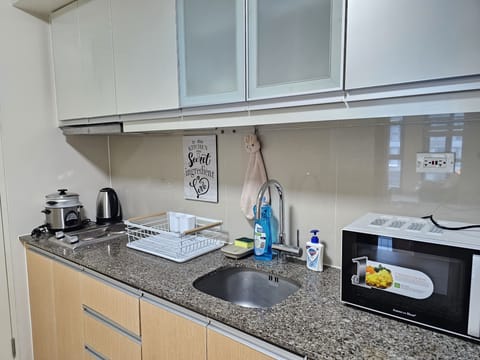 Comfort Condo | Private kitchen | Fridge, microwave, stovetop, electric kettle