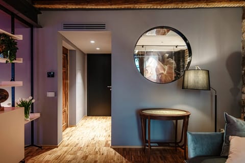 Deluxe Suite | Living area | 40-inch LED TV with satellite channels