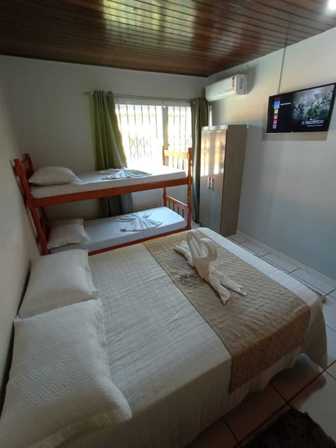 Basic Quadruple Room, 1 Bedroom | Bathroom | Shower, free toiletries, hair dryer, towels