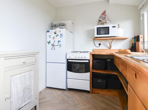 Fridge, electric kettle, toaster, cookware/dishes/utensils