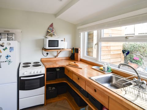 Fridge, electric kettle, toaster, cookware/dishes/utensils