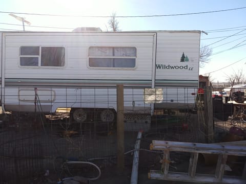 One side view of camper w/ pop-out