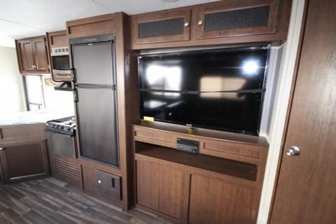 Big Screen Television and surround sound entertainment system viewable from entire living, dining and bunk rooms.  