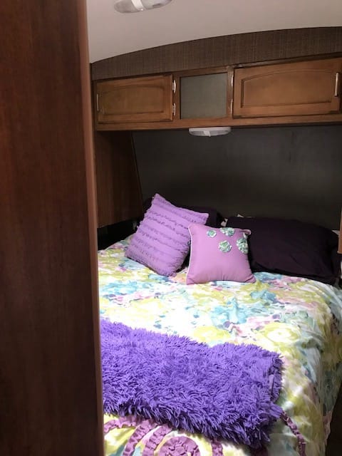 Bedroom: Regular Queen size mattress; closets on both sides; storage above bed and below mattress for extra storage space with separate wall mounted 35"flat Screen TV