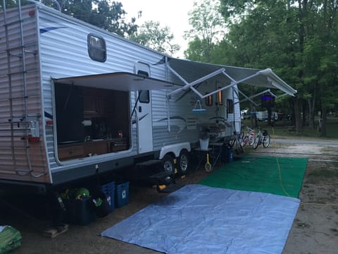 Exterior. Pictured are 2 entrances (one to the bathroom), and the outdoor kitchen.