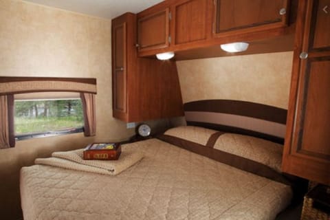 Master Bedroom (stock photo). Queen sized bed. This trailer comes equipped with an RV sized Sleep Number mattress.