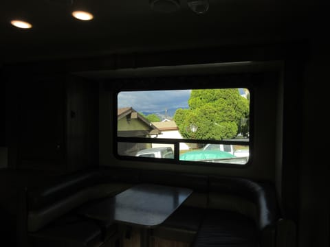 From the entrance view of the dining area of the RV.  When parked the dining area allows for more space by pressing a button to expand this space outward.