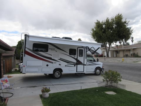 This is an outside view of the RV.  (The back ladder is used for maintenance on the top of the vehicle and is bent a little, you will not be responsible for this if you rent from us.)