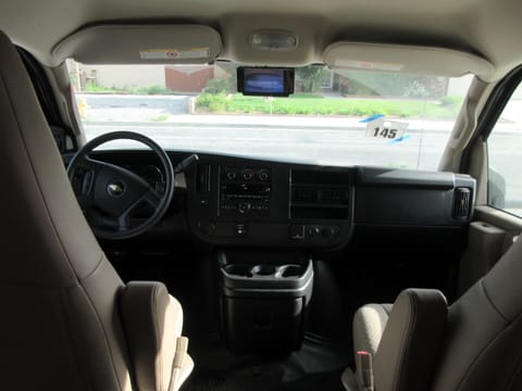 Driver and passenger area.  RV is equipped with rear view camera.