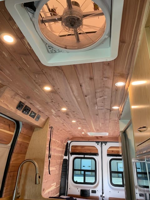 Natural wood interior with ceiling fans and lights with dimmer switch