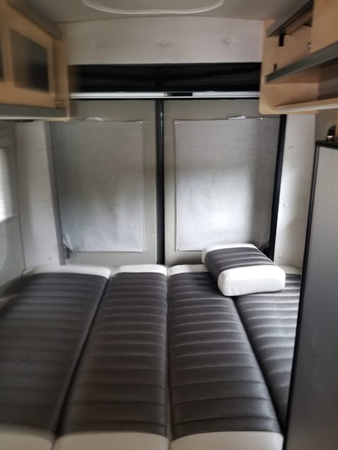 This is the back of the van configured in a bed setup.  The other configuration is a dining area.