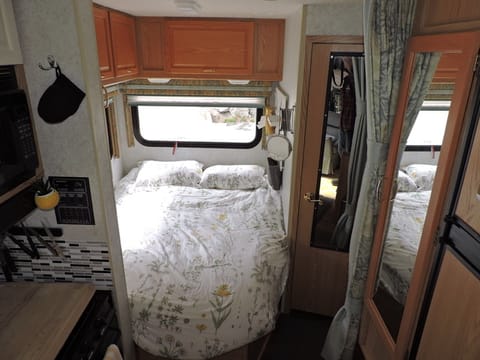 Rear queen bed with firm mattress, lots of cupboard space and bright rear windows
