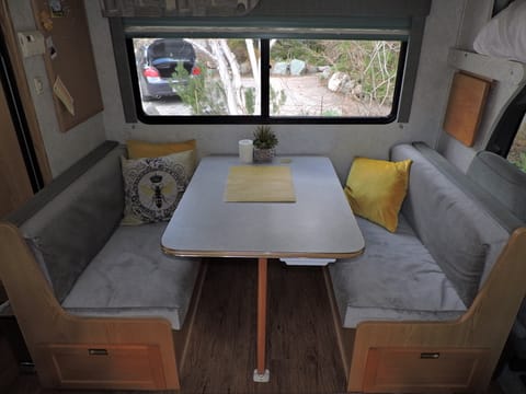 New upholstery on dinette/table becomes bed and storage under seats