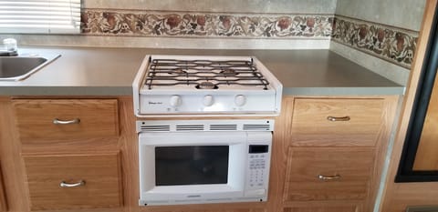 Stove top and microwave. 