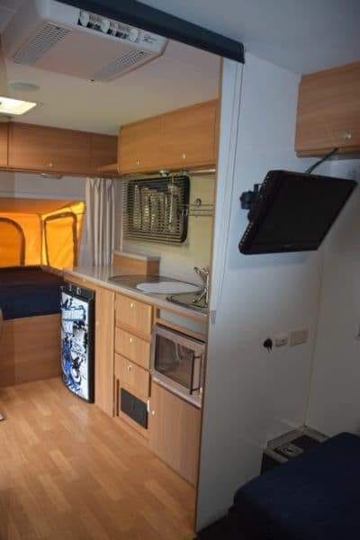 Timmy has a TV with DVD player, gas cooker and grill, 3 way fridge and sink with hot water