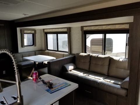 Large sofa and u-shaped dinette, also convert to sleeping accommodations. 2 at the dinette and 2 at the couch, unless you've got small children, you can pack them in...