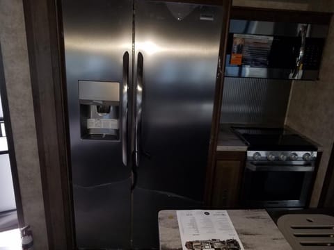 Full size refrigerator with ice maker and filtered water. 