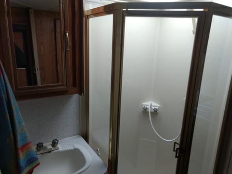 Nice size shower , sink toilet is separate room across the hall.