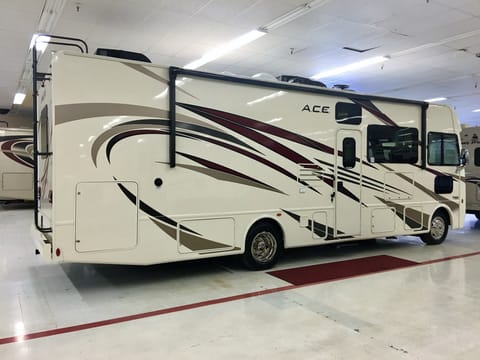 Huge 19-foot powered side awning with built-in LED lighting.  No slide on passenger side allows for maximum usable space under the open awning.  Exterior TV behind compartment door.  Great for people to sit outside, watch movies or sports, and others can be nearby around a campfire.