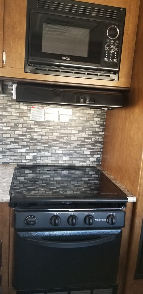 Glass cover over stove to make more room for meal prep or putting the cookies on a baking rack to cool.