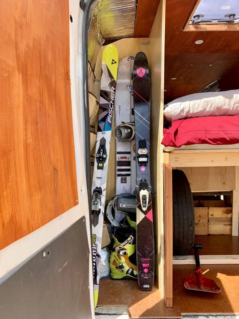 Multiple skis  and snowboard fit in the back with room for boots.