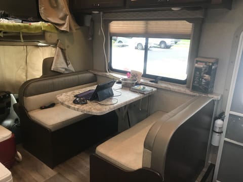 4 person dinette. Also serves as a mobile office if you can’t leave it at home (leave it at home). Multiple 110 power outlets and USB plugs throughout the dining and kitchen area.