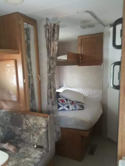 Double bed below, single bunk above. Closet with mirror. privacy curtain. 