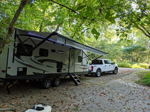 Awning provides ample front patio space, weather and sun protection, and speaker/ light/ external power for any outdoor activities.