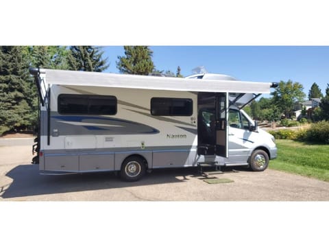 The automatic awning comes out at the push of a button and covers nearly the length of the RV.