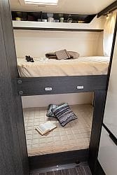 Rear bunks, the bottom bunk can be lifted to create a large garage space.