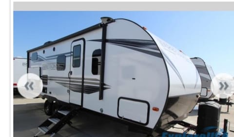 A beautiful Forest River - Impression Travel trailer. Double door with screen, awning comes out to 19', outdoor speakers allows you to feel the music surrounded by the stars and a grill area with cook tops and refrigerator to have everything ready in one spot.