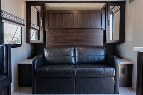 During the day enjoy lounging on a black leather couch and at night fold down the murphy bed for a very comfortable sleep (2 adults).