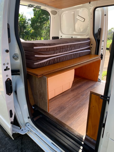 Under the bench seat is your cooler and room for bags.  Flip into bed mode for pass thru storage 