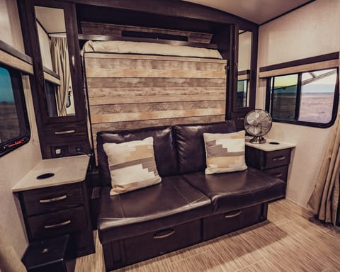 Queen size and walk-around Murphy bed, wood trim, mirrored his-and-hers hanging wardrobes, stainless Vornado Fan.