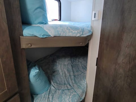These twin bunks are super cozy! 
 The top bunk has a capacity of 300lbs.