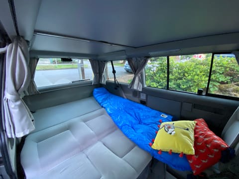 The backseat folds down and makes into a full-size bed that sleeps two. 