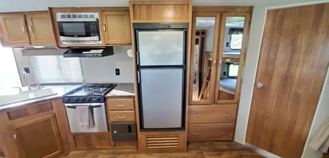 Fridge/freezer, lots of cabinet space. Cooking and eating utensils provided. 